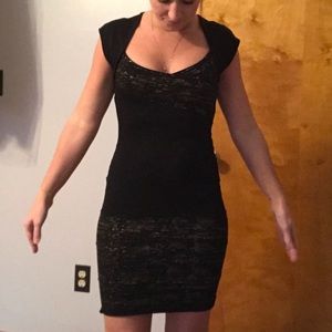 Black dress has gold in it